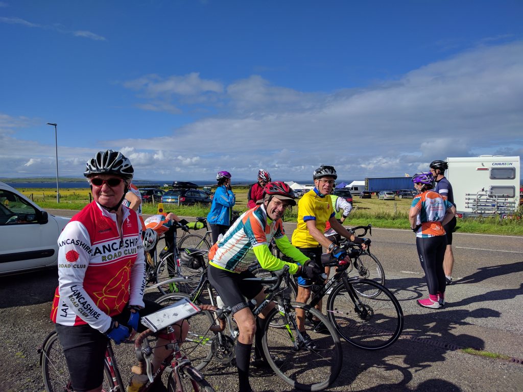 Gathering for entrance to John o'Groats and completing the challenge